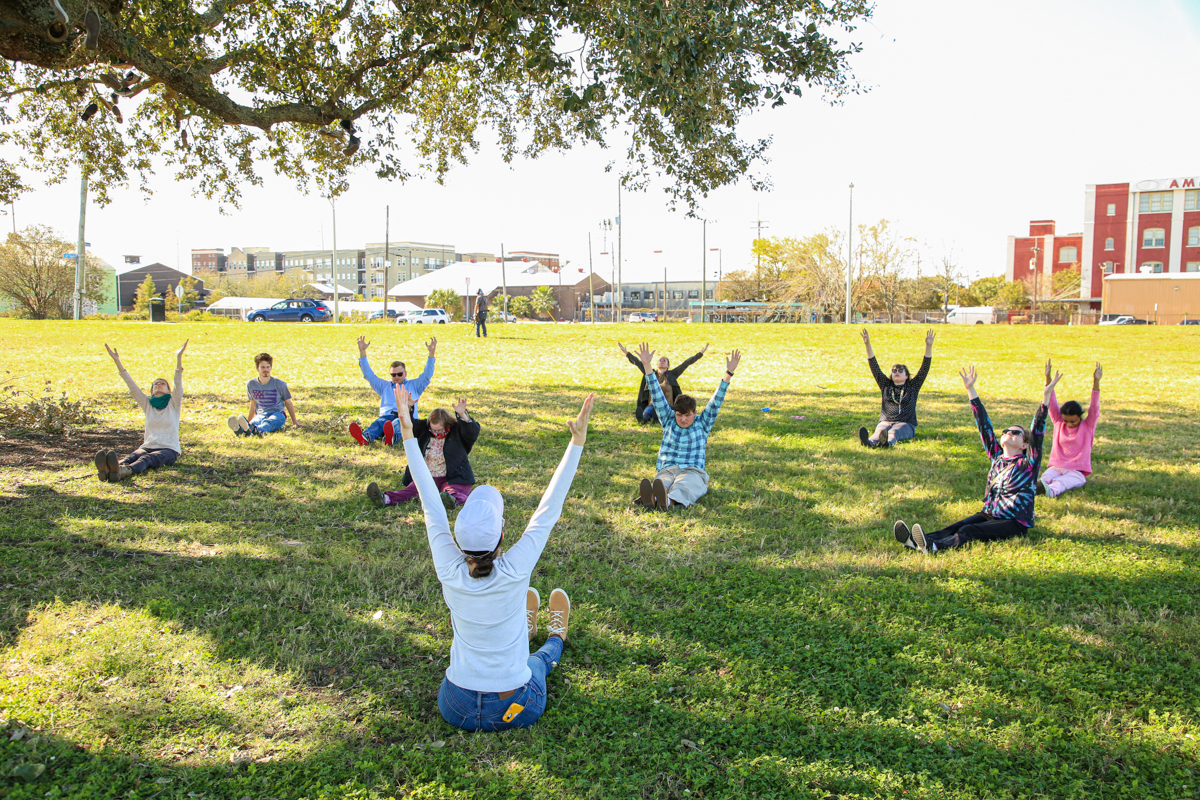 Guild members do yoga outdoors